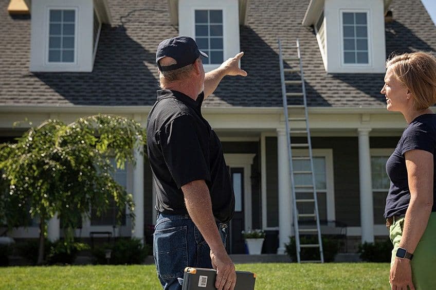 contractor and customer outside of house
